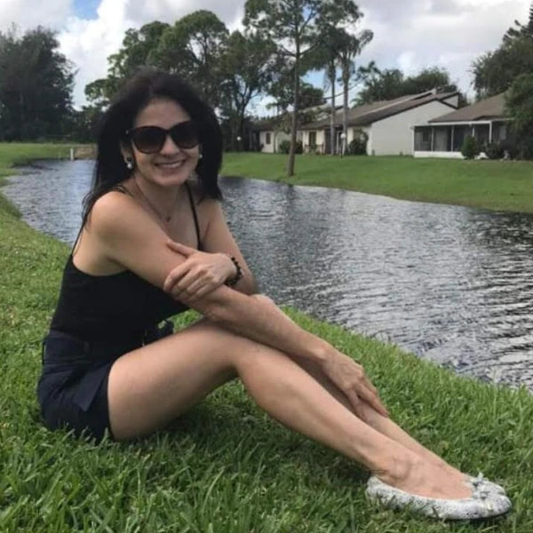 A photo of Liana from Washington D.C. wearing Oh!pedics shoes: 'Oh!pedics flats are a must-have for anyone with foot pain like me. They look great on my feet and are incredibly supportive.'