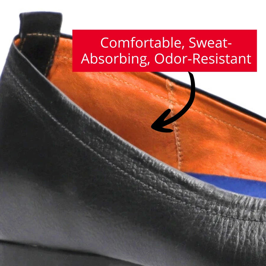 Close-up view of the leather lining inside a black ballet flat, showcasing the smooth, genuine cowhide leather with minimal seams. Overlay text reads: 