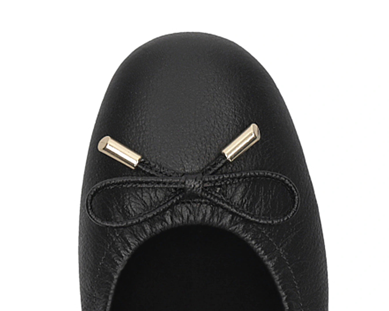 Close-up of the embossed grain leather on Black full-grain leather ballet flats with removable BLACK FlexiComfort orthotic for flat feet and 24k-gold-plated-bows.