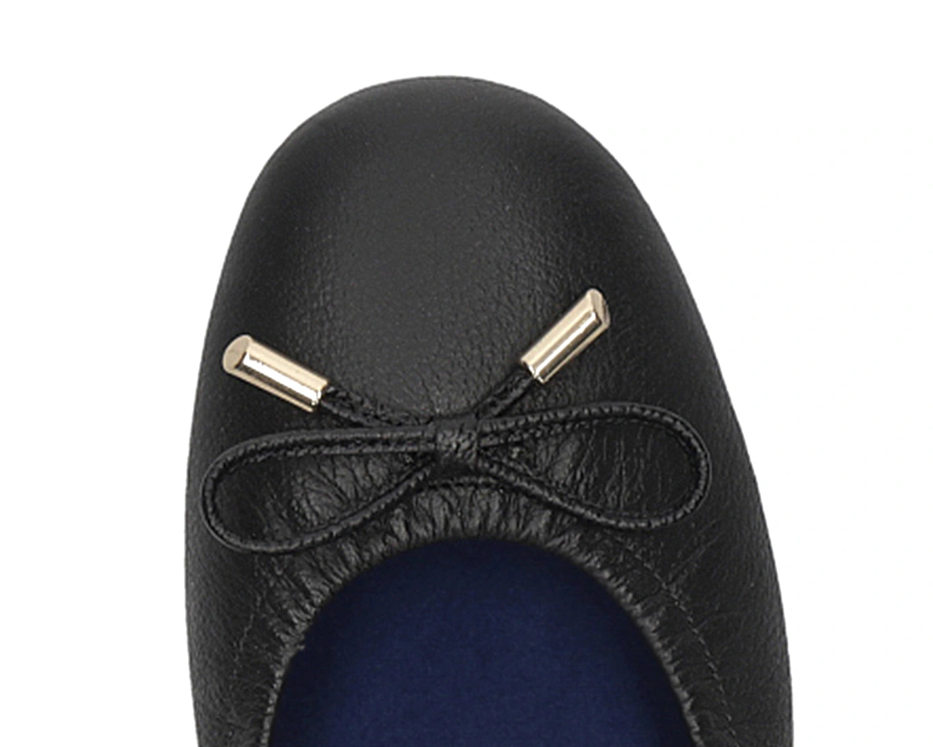 Close-up of the embossed grain leather on Black full-grain leather ballet flats with removable BLUE ComfortFlex orthotic for feet without problems and 24k-gold-plated-bows.