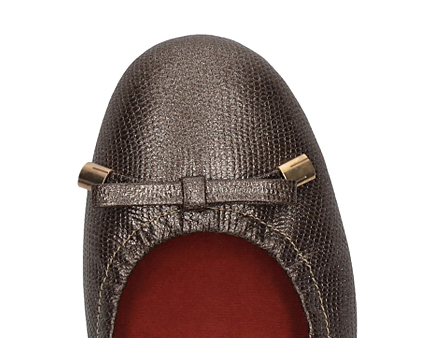 Close-up of bronze wild-embossed full-grain leather ballet flats with an elegant bow and gold tips, featuring a removable RED ArchSupport orthotic, designed for flat feet, calcaneal spurs, and plantar fasciitis.