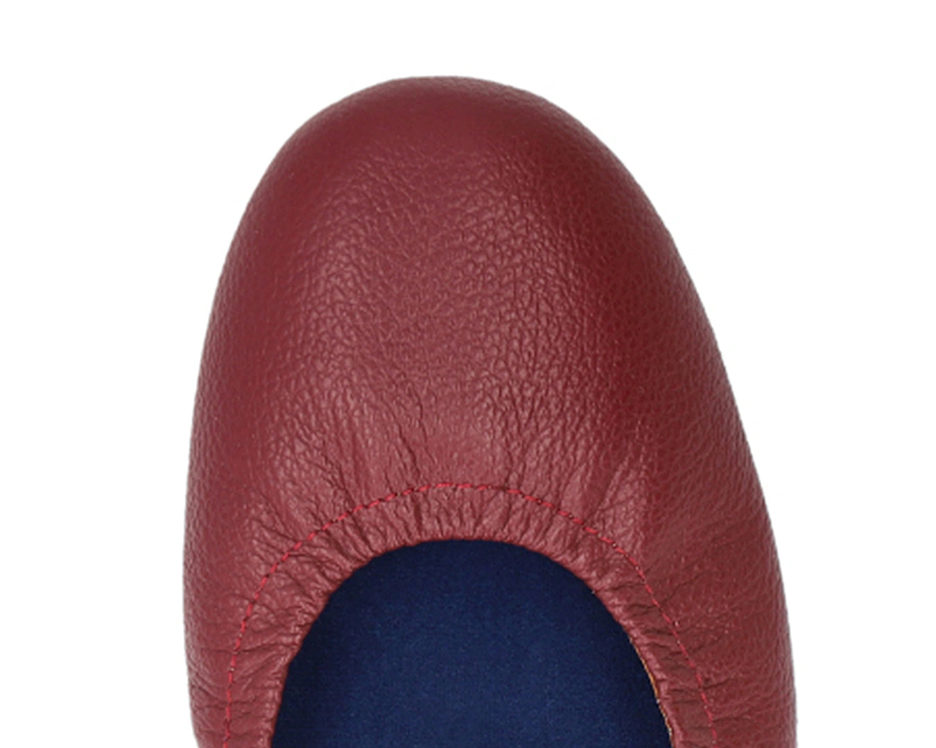Close-up of full-grain leather on Burgondy Ballet Flats with removable BLUE ComfortFlex orthotic for feet without problems.