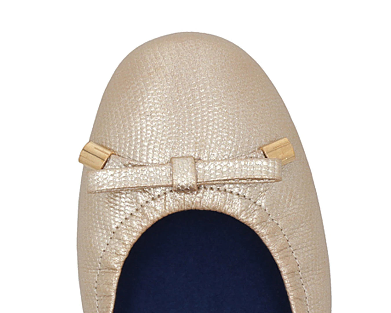 Close-up of gold wild-embossed full-grain leather ballet flats with an elegant bow and gold tips featuring a  removable BLUE ComfortFlex orthotic for feet without problems.