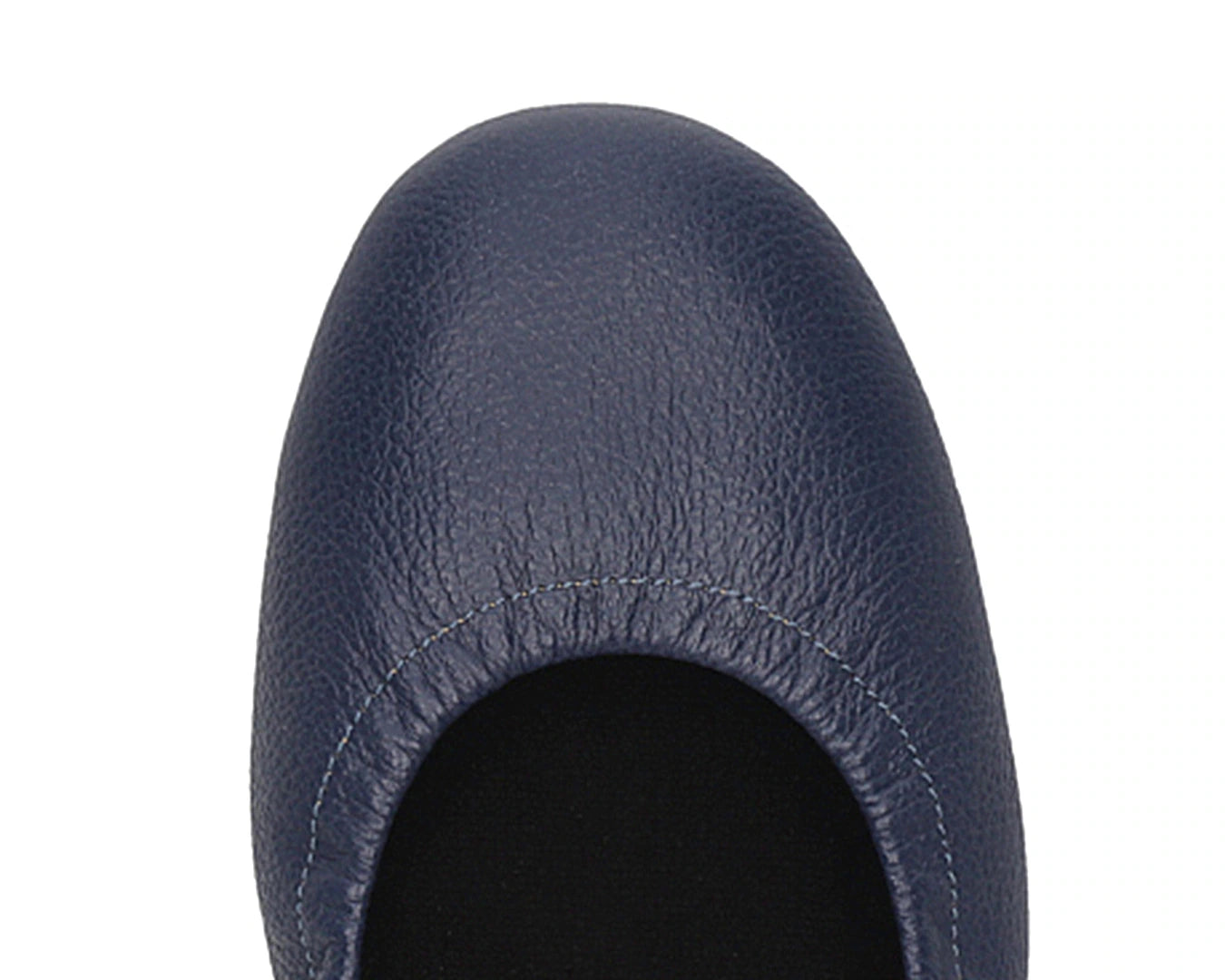 Close-up of the embossed grain leather on navy full-grain leather ballet flats with removable BLACK FlexiComfort orthotic for flat feet.
