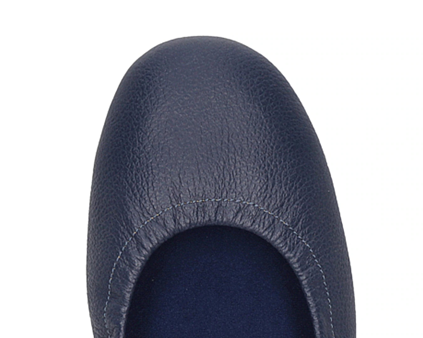 Close-up of the embossed grain leather on navy full-grain leather ballet flats with removable BLUE ComfortFlex orthotic for feet without problems.