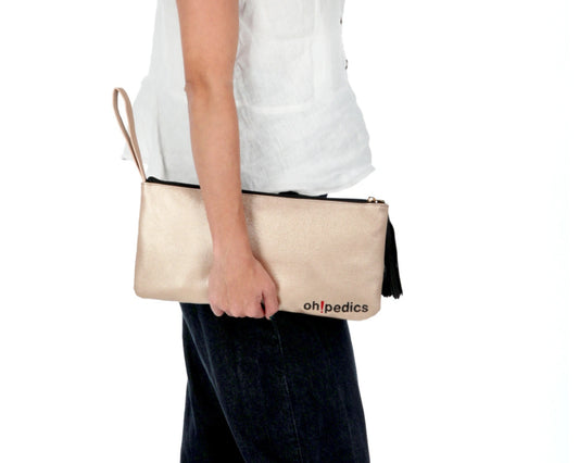 A woman holding the oh! Go Full-Grain Leather Bag, displaying its sleek front design. Made from high-quality full-grain leather, perfect for everyday elegance.