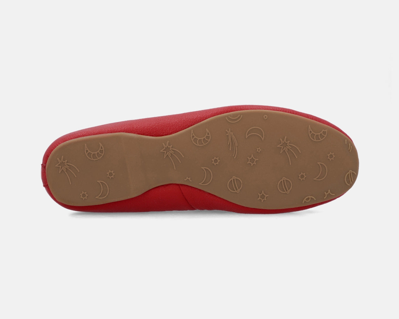 Sole view of red full-grain leather ballet flats showing the one-piece rubber sole.