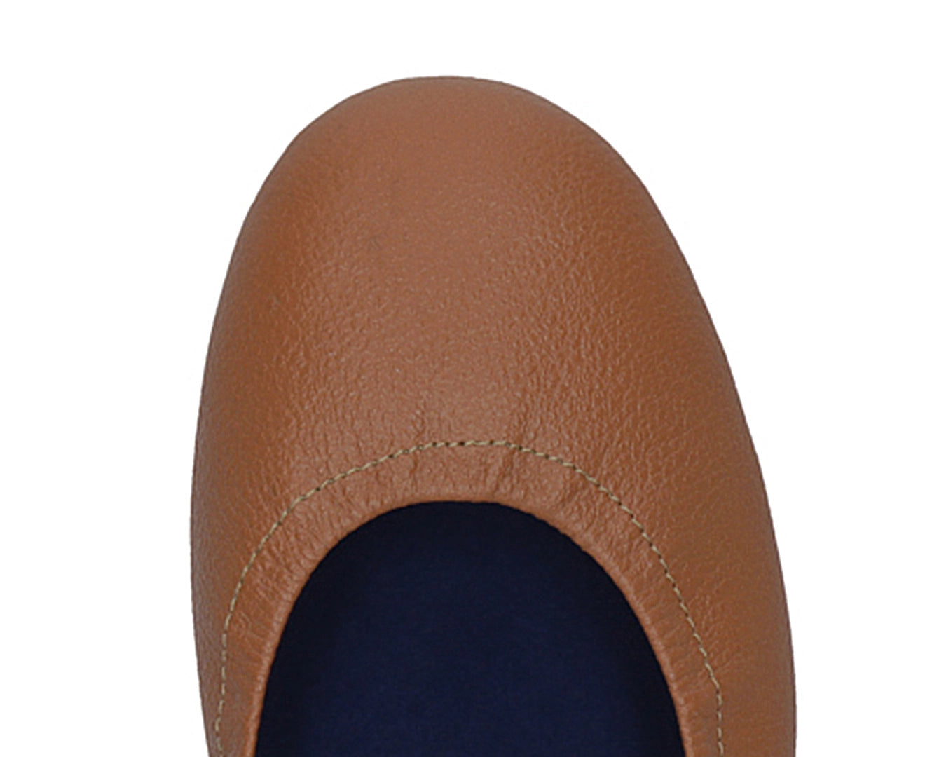 Close-up of full-grain leather on Tan Ballet Flats with removable BLUE ComfortFlex orthotic for feet without problems.