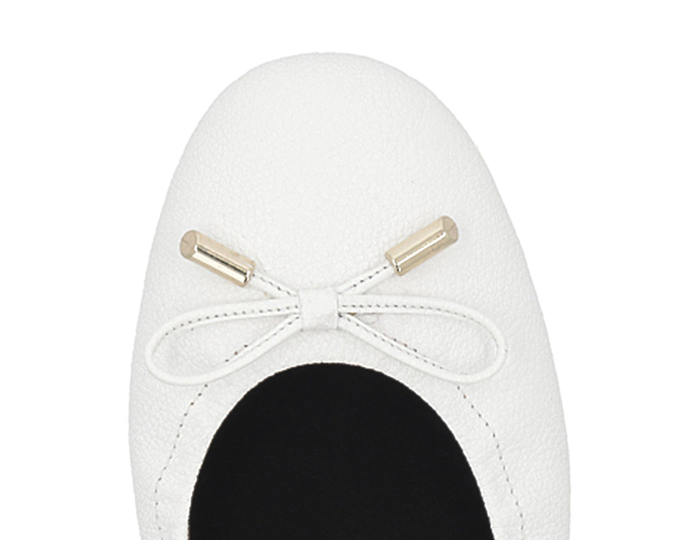 Close-up of the embossed grain leather on White full-grain leather ballet flats with removable BLACK FlexiComfort orthotic for flat feet and 24k-gold-plated-bows.
