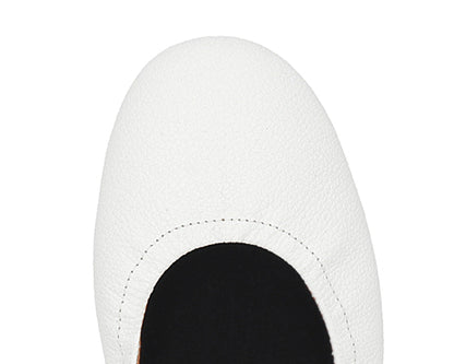 Close-up of the full-grain leather on White Ballet Flats with removable BLACK FlexiComfort orthotic for flat feet.